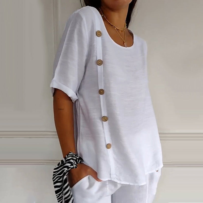 Women's blouse with round neckline and buttons on the side